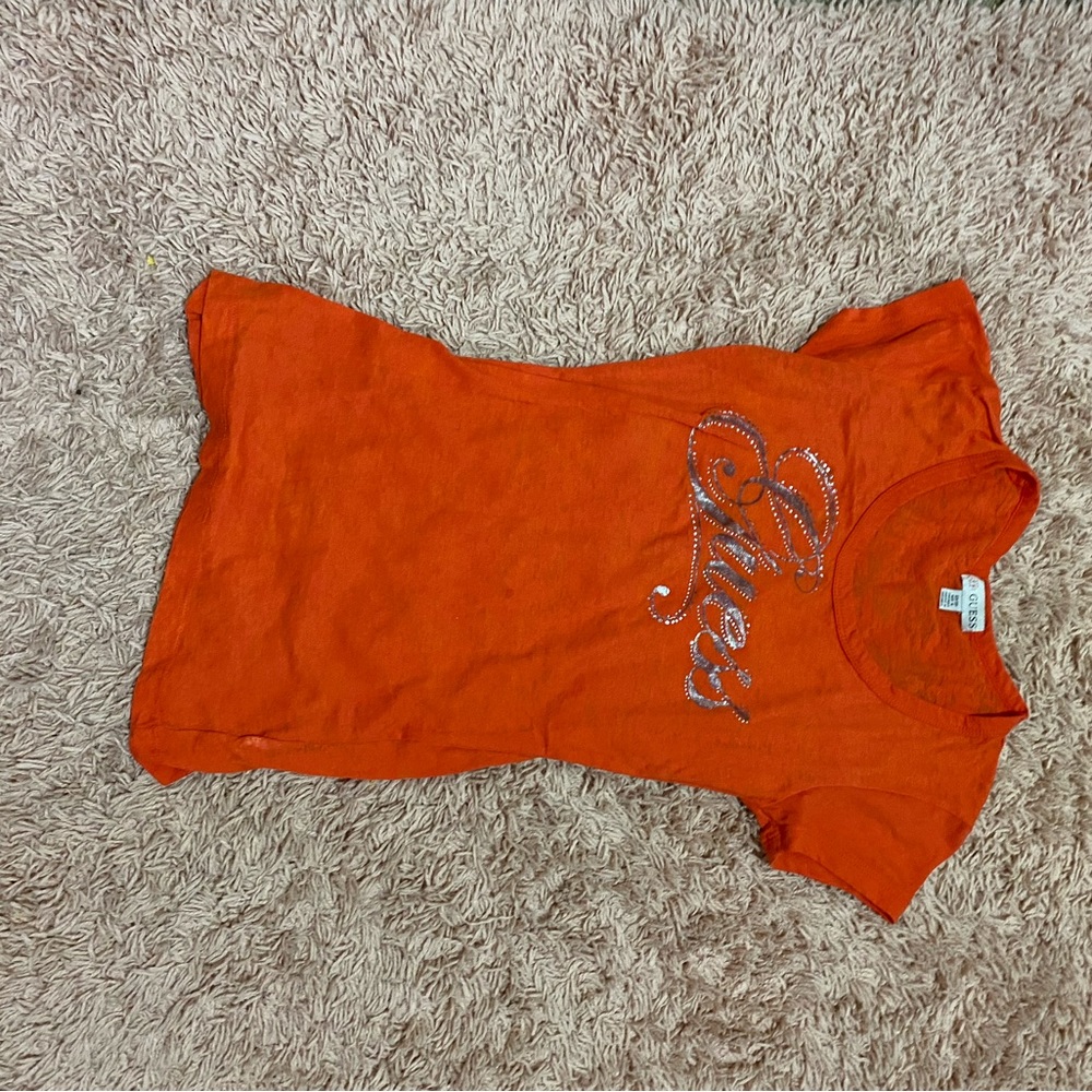 Orange guess top.